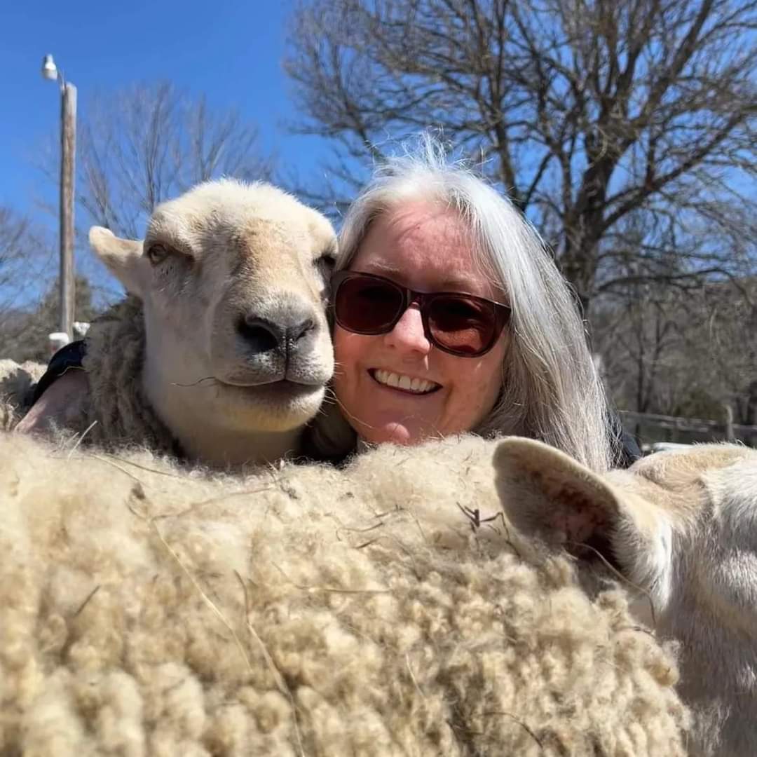 kelly mcdermott-burns with two sheep